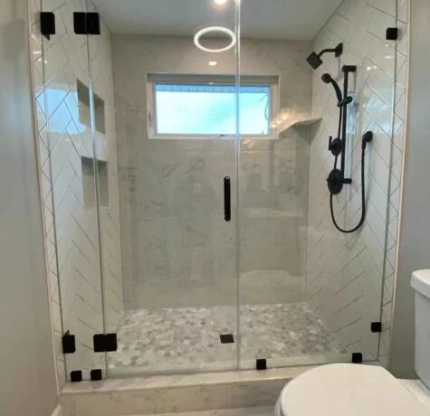 Frameless Pivot Door by Easco - Custom frameless glass shower enclosure. Premium hinges and